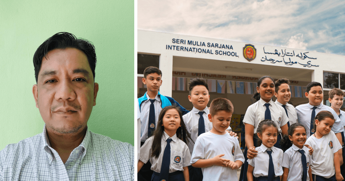 Man on the left and a diverse group of smiling school children in uniform in front of Seri Mulia Sarjana International School.